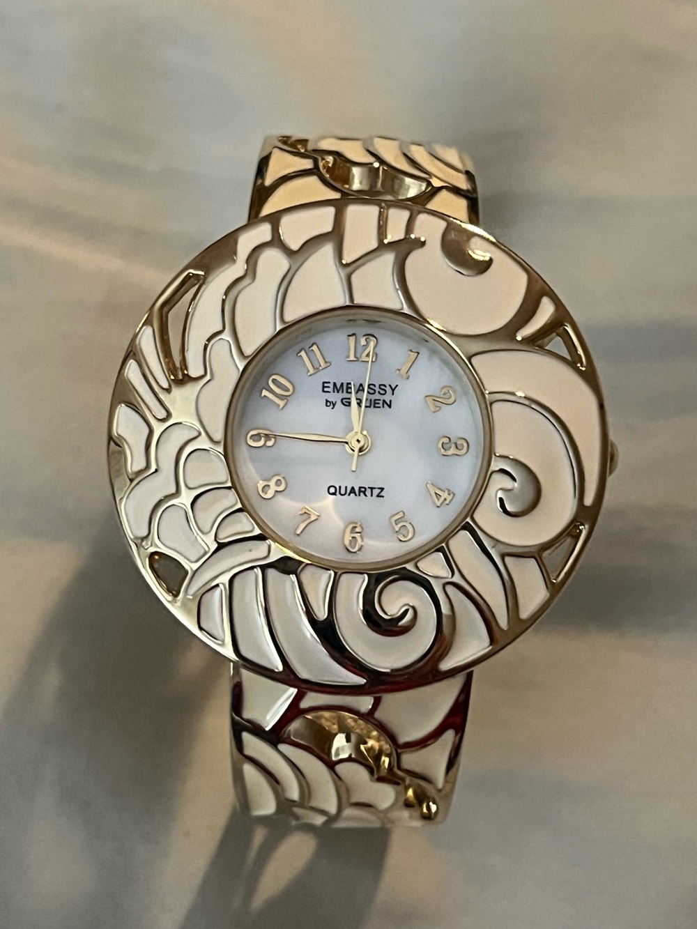 1990’s Embassy by Gruen Women's White and Gold Decorative Bangle Watch